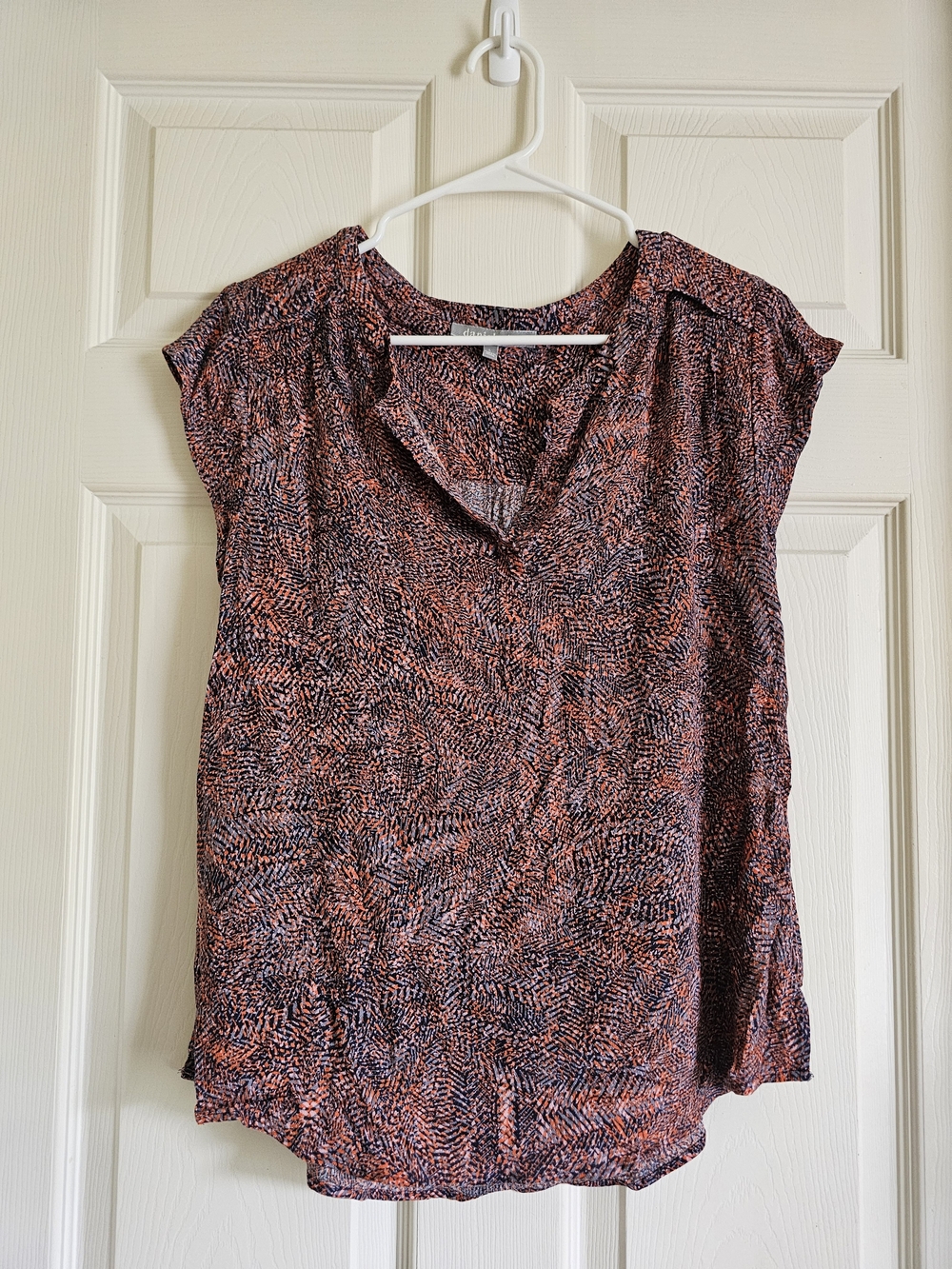 Lightweight and versatile Daniel rainn cap-sleeve blouse featuring an intricate